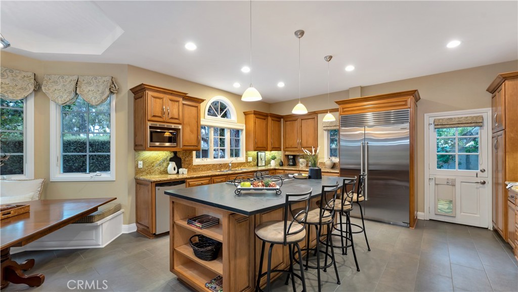 2 Rainstar Irvine, CA 92614 - Photo 20 of 49 a kitchen with stainless steel appliances granite countertop a stove and a refrigerator