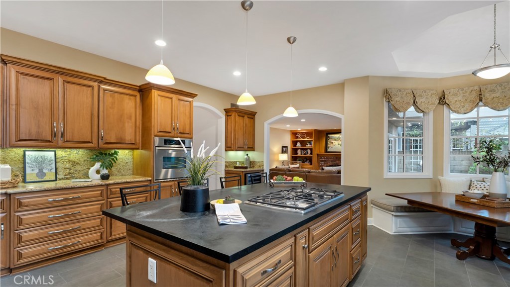 2 Rainstar Irvine, CA 92614 - Photo 23 of 49 a living room with stainless steel appliances granite countertop a sink table and chairs