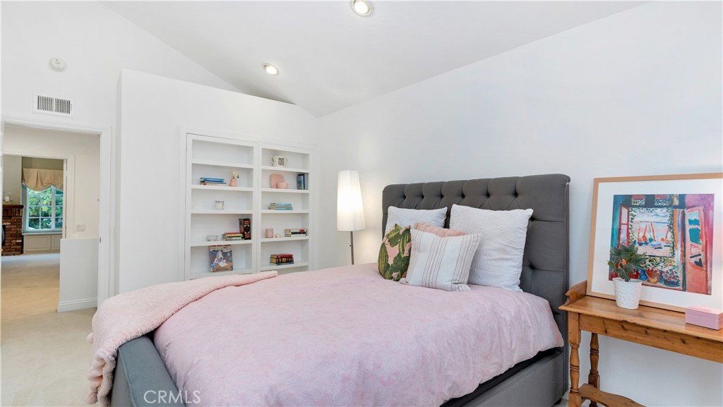 2 Rainstar Irvine, CA 92614 - Photo 27 of 49 a bedroom with a bed and a book shelf