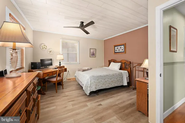 a bedroom with a bed and a desk