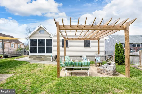 a front view of a house with a yard table and chairs