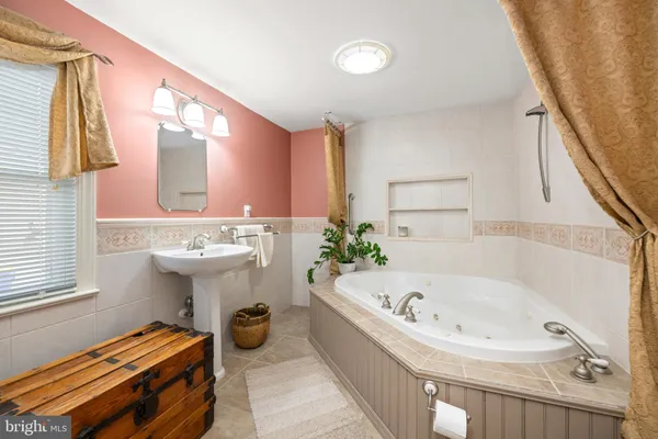 a bathroom with a bathtub and a sink