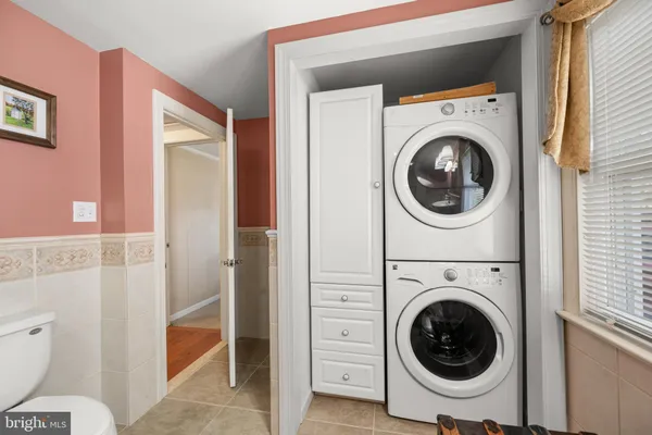 a view of a hallway with washer and dryer