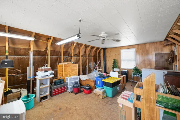 a very nice looking room with many windows and furniture