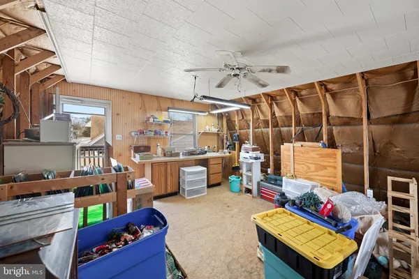 a living room with furniture a rug and a table