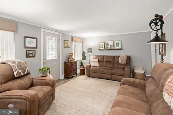 a living room with furniture and a couch