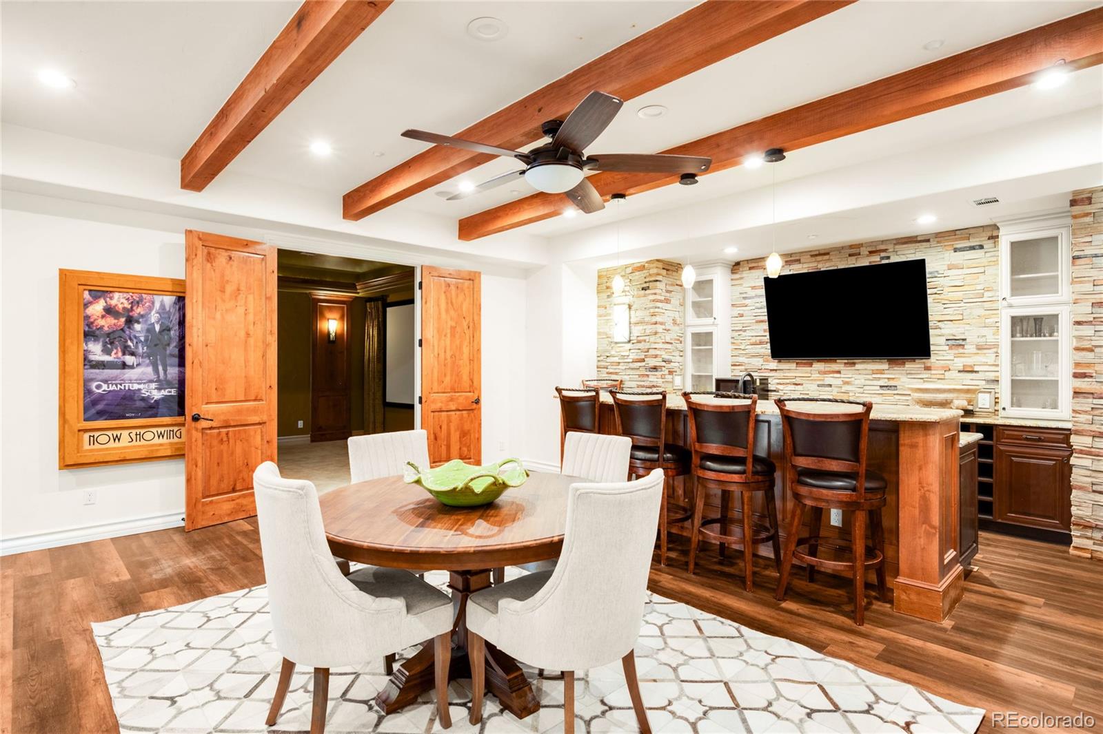 981 Buffalo Ridge Road Castle Pines, CO 80108 - Photo 37 of 49 a view of a dining room with furniture