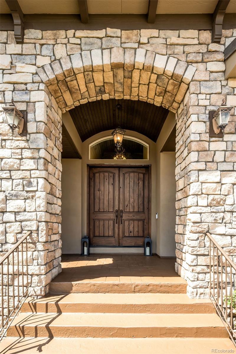 981 Buffalo Ridge Road Castle Pines, CO 80108 - Photo 5 of 49 a view of a door of the house