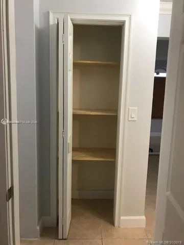 a view of closet area with empty racks