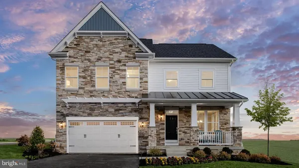 a front view of a house with garage