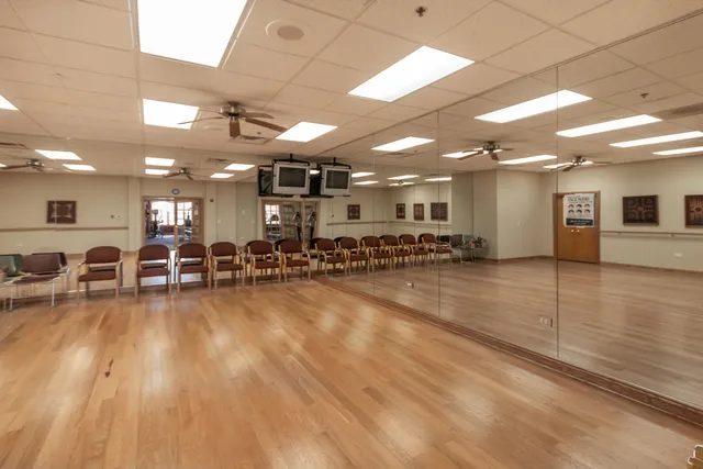 a lobby with furniture and wooden floor