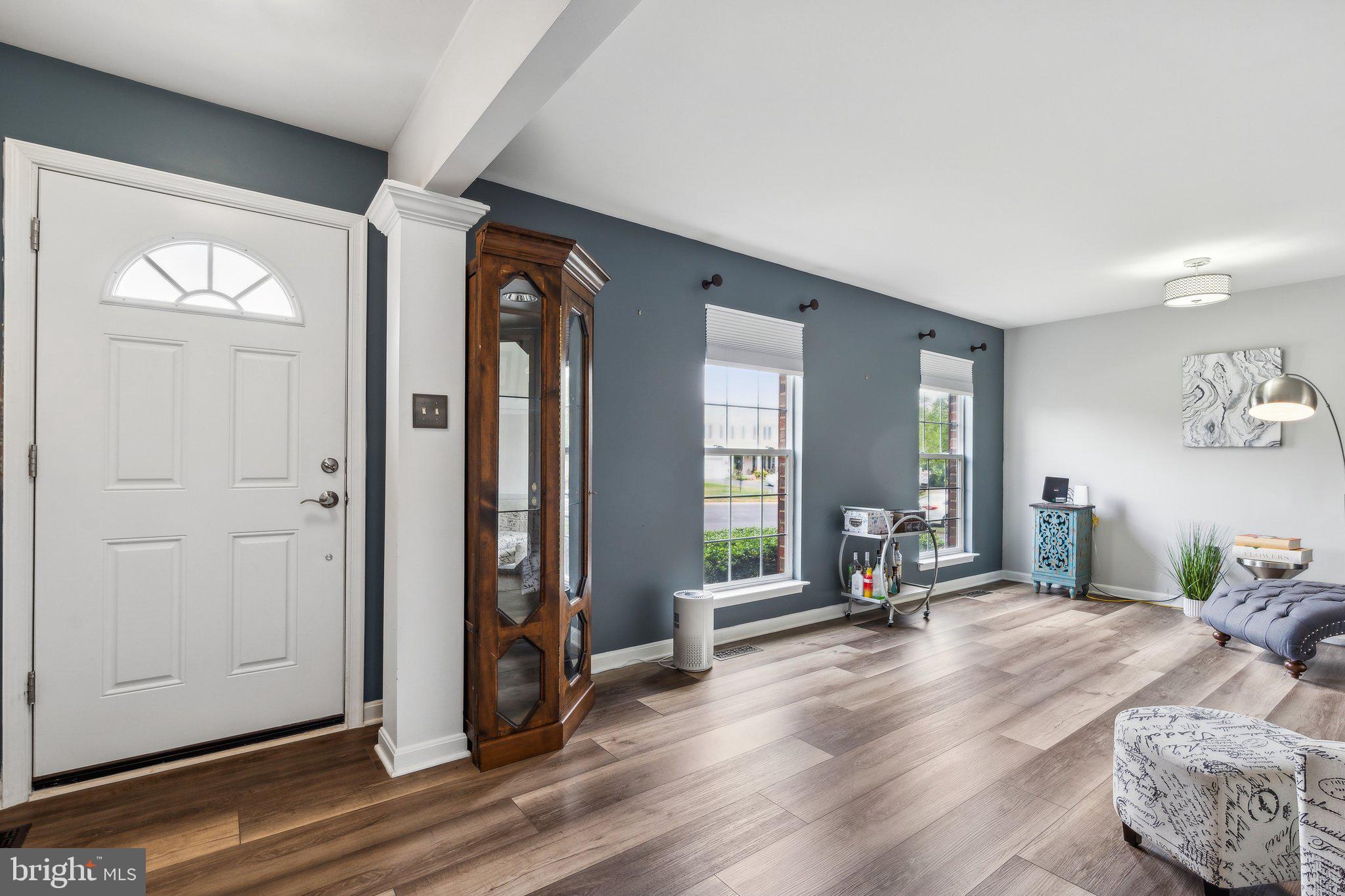 20575 Coppersmith Drive Ashburn, VA 20147 - Photo 4 of 51 Entryway with 1/2 bath and living room