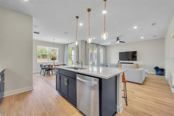 a kitchen with center island and stainless steel appliances