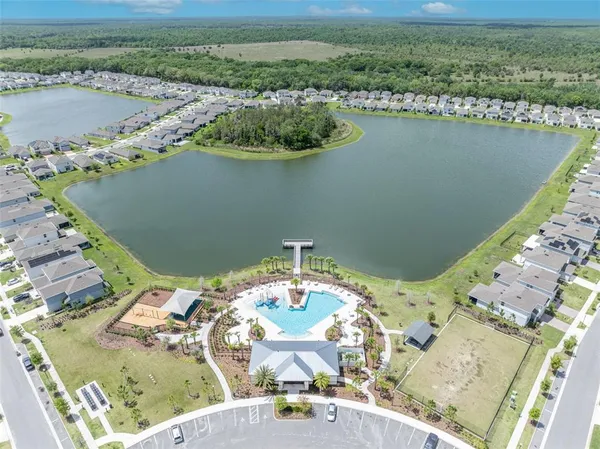 an aerial view of a house with a lake view