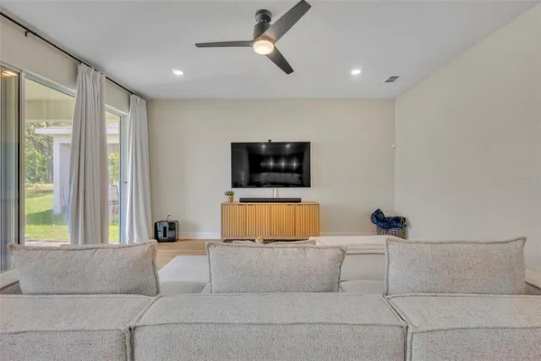 a living room with couch and a window
