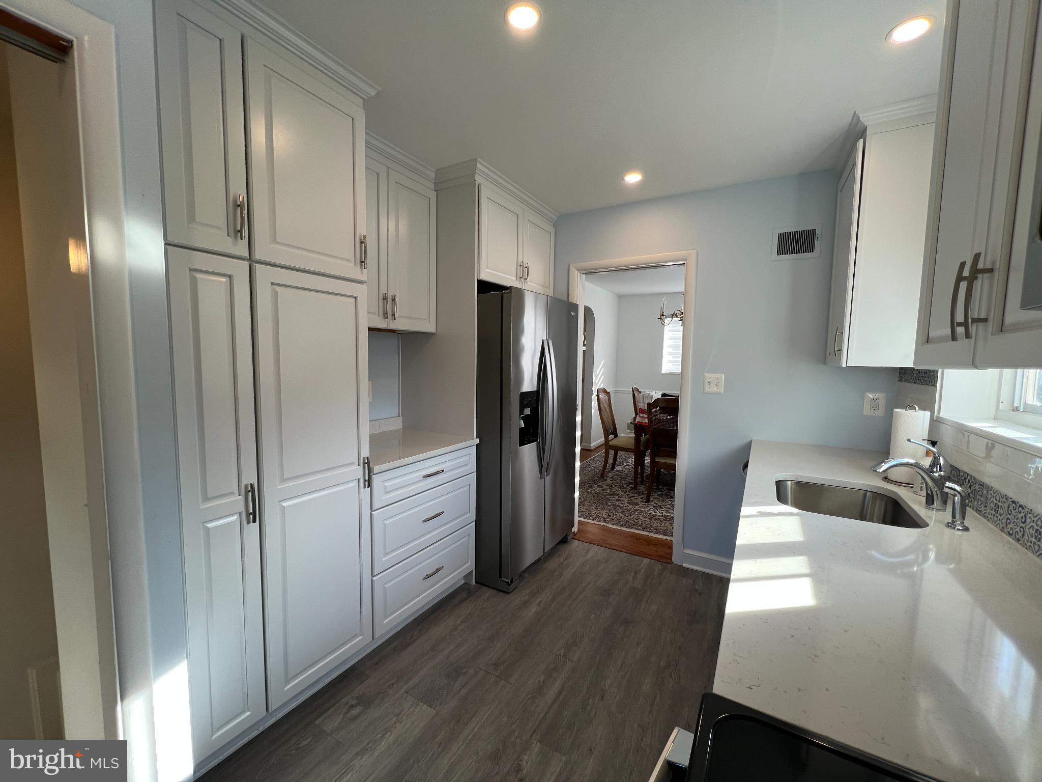6205 Kirby Road Bethesda, MD 20817 - Photo 11 of 42 Modern kitchen with sleek cabinetry and light.