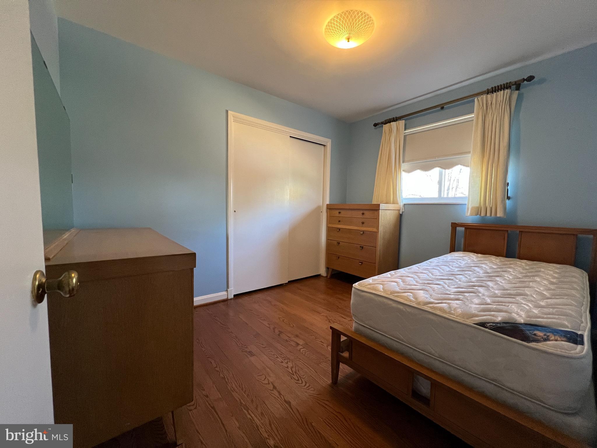 6205 Kirby Road Bethesda, MD 20817 - Photo 18 of 42 Serene bedroom with soft blue walls.