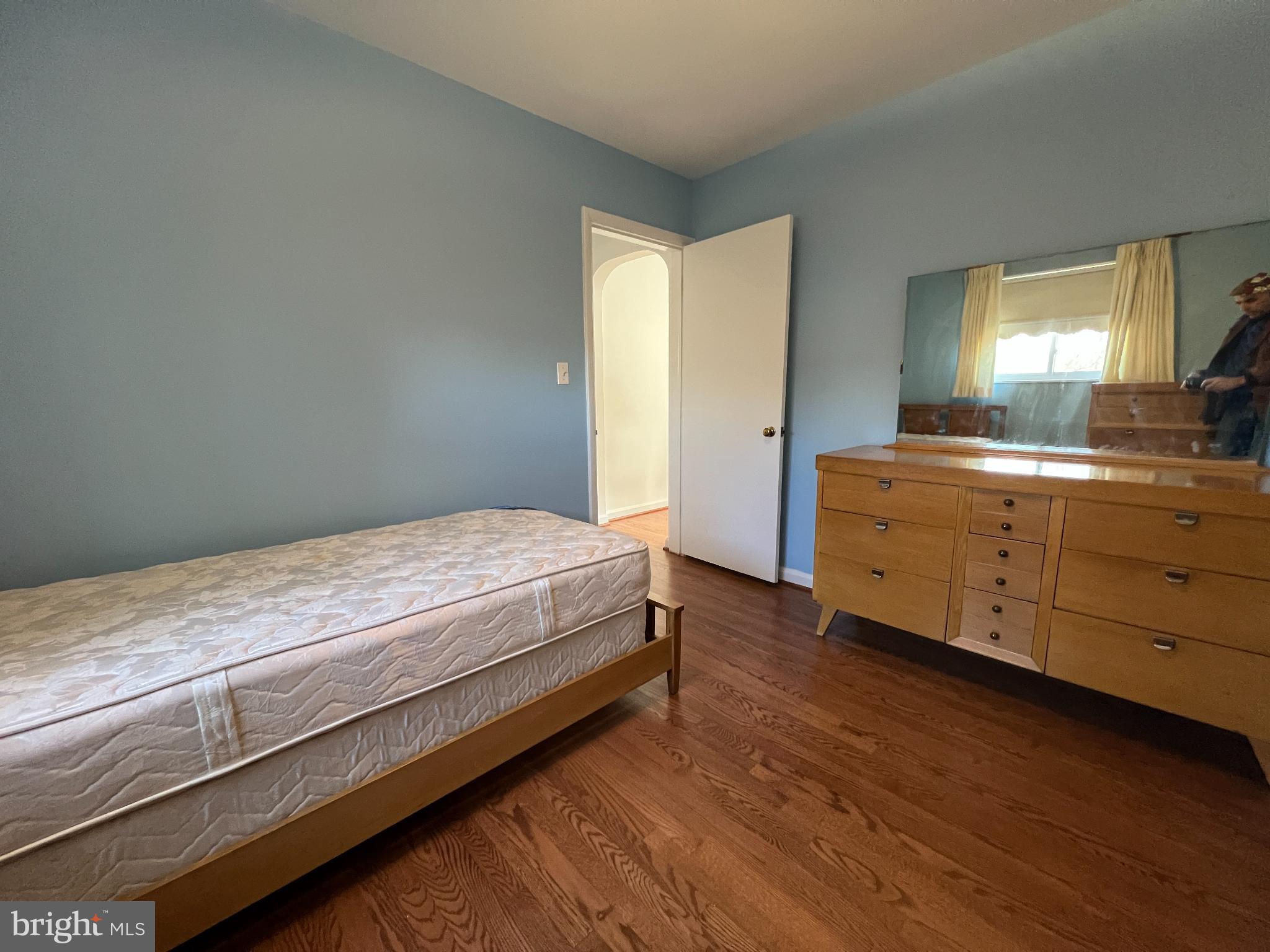 6205 Kirby Road Bethesda, MD 20817 - Photo 19 of 42 Serene bedroom with warm wooden accents.