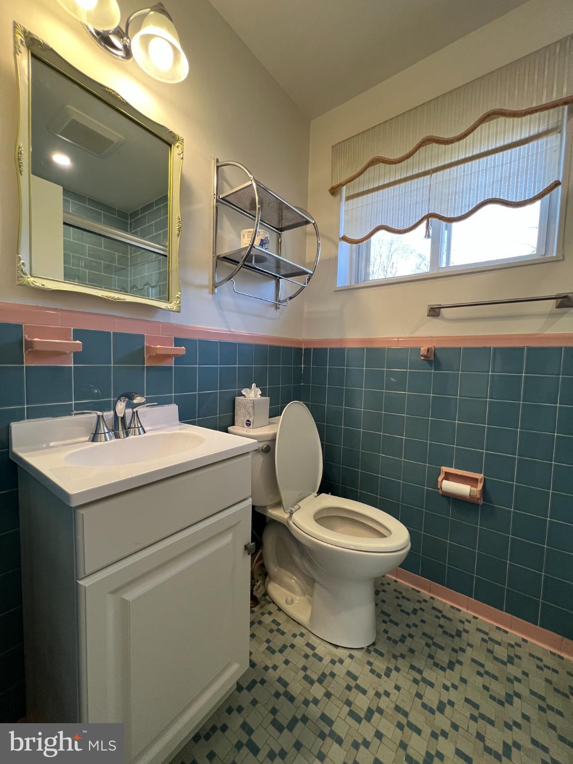 6205 Kirby Road Bethesda, MD 20817 - Photo 20 of 42 Charming retro bathroom with vibrant tiles.
