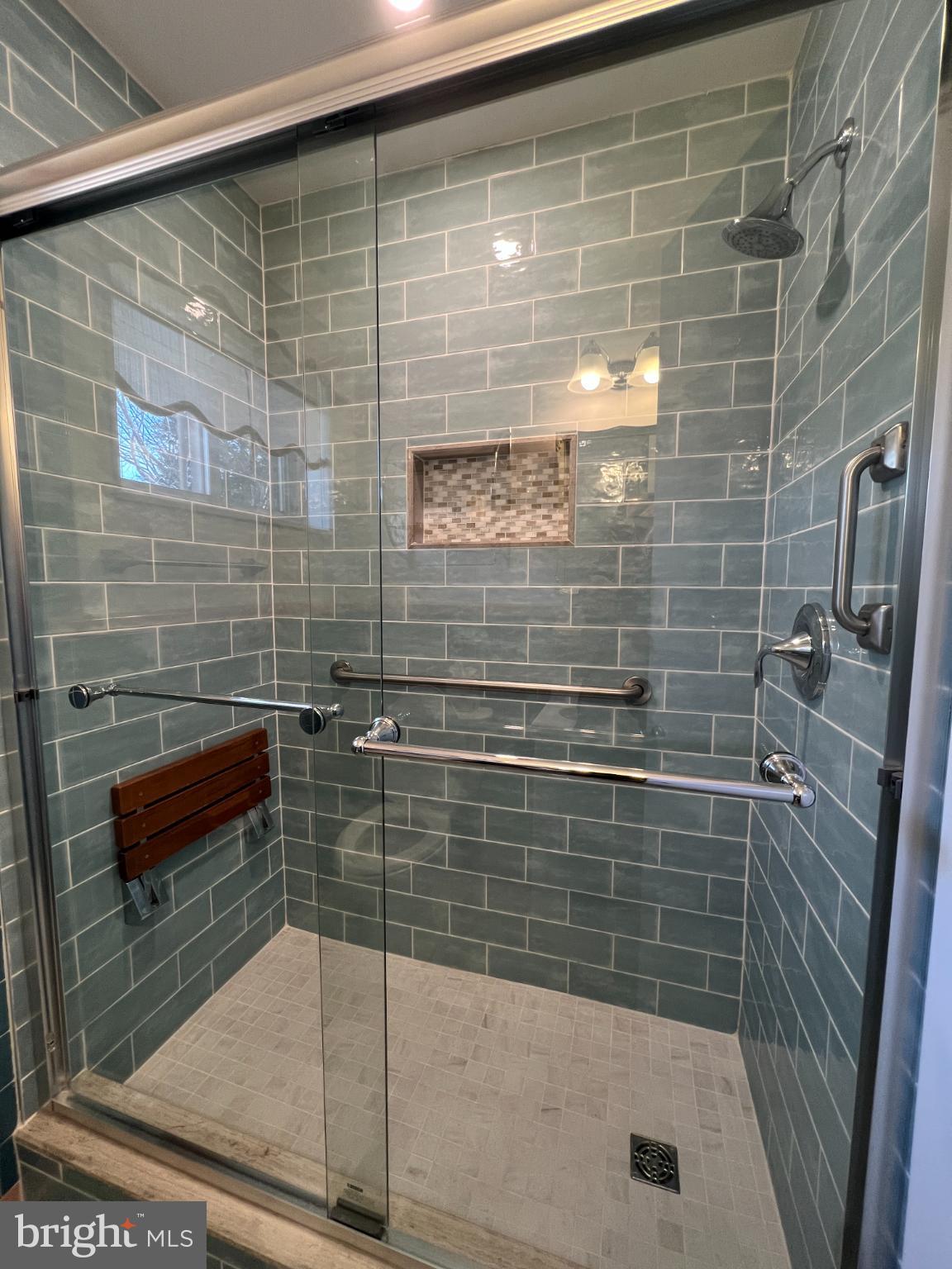 6205 Kirby Road Bethesda, MD 20817 - Photo 21 of 42 Stylish, accessible shower with modern tiles.