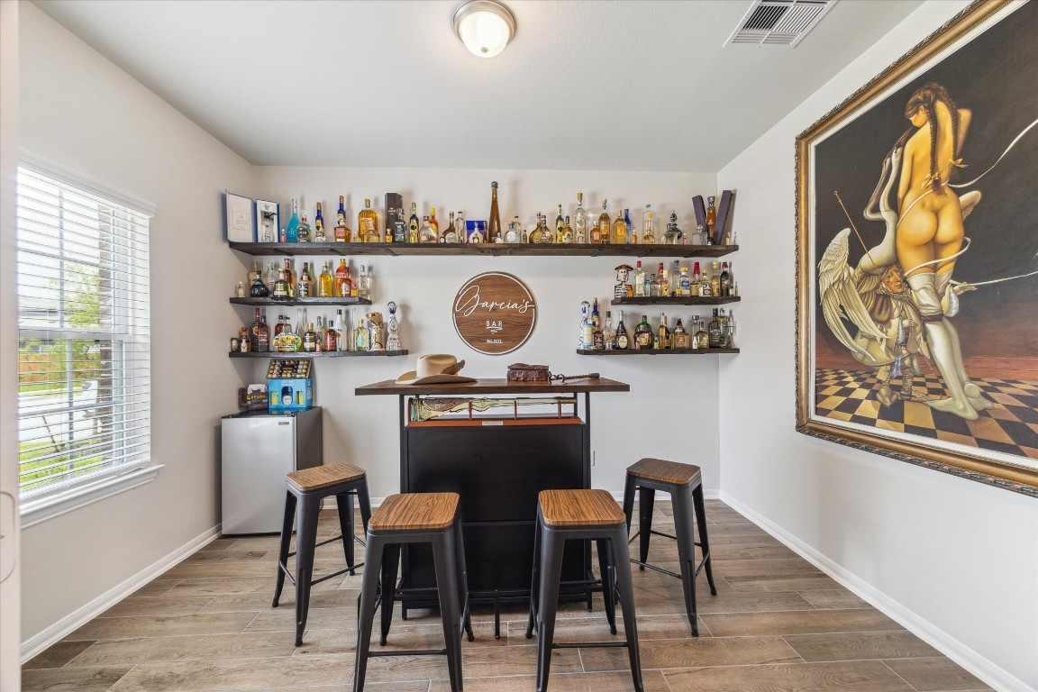 1523 Alpine Drive Rosharon, TX 77583 - Photo 12 of 25 a view of a dining room with a table and chairs
