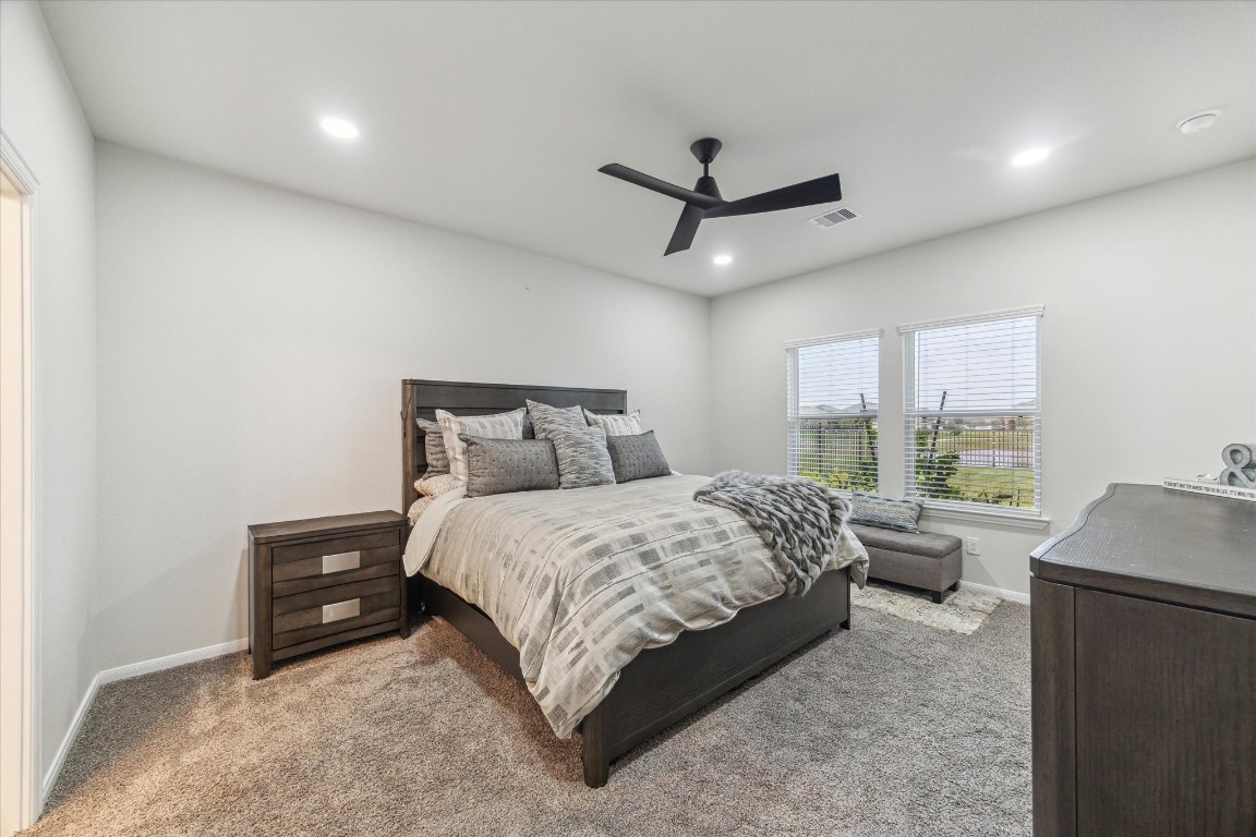 1523 Alpine Drive Rosharon, TX 77583 - Photo 15 of 25 a bedroom with a large bed and a large window