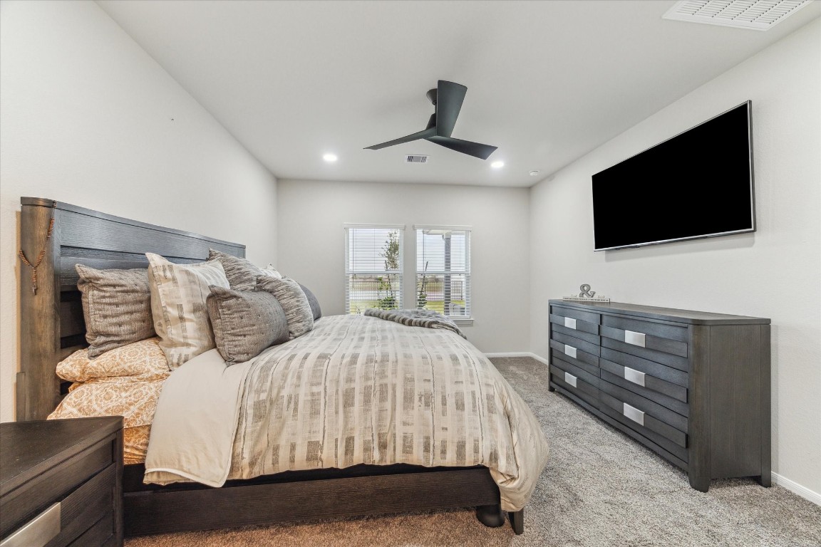 1523 Alpine Drive Rosharon, TX 77583 - Photo 16 of 25 a bedroom with a bed and a flat screen tv