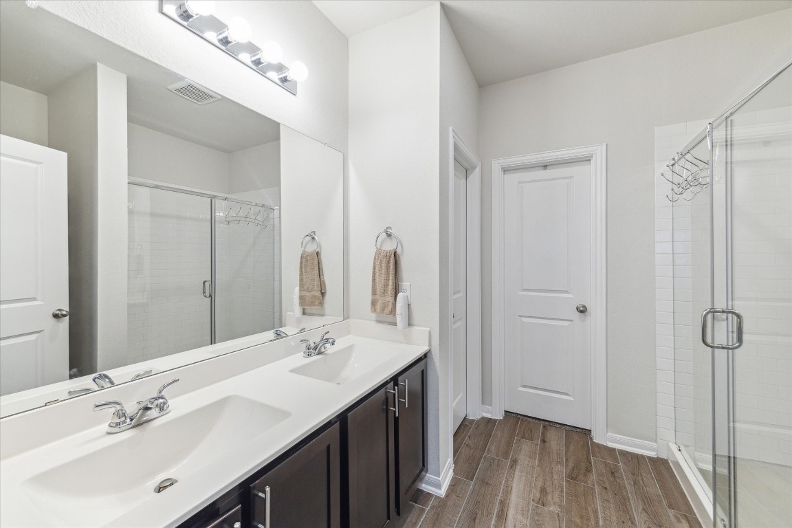 1523 Alpine Drive Rosharon, TX 77583 - Photo 17 of 25 a spacious bathroom with a double vanity sink mirror and shower