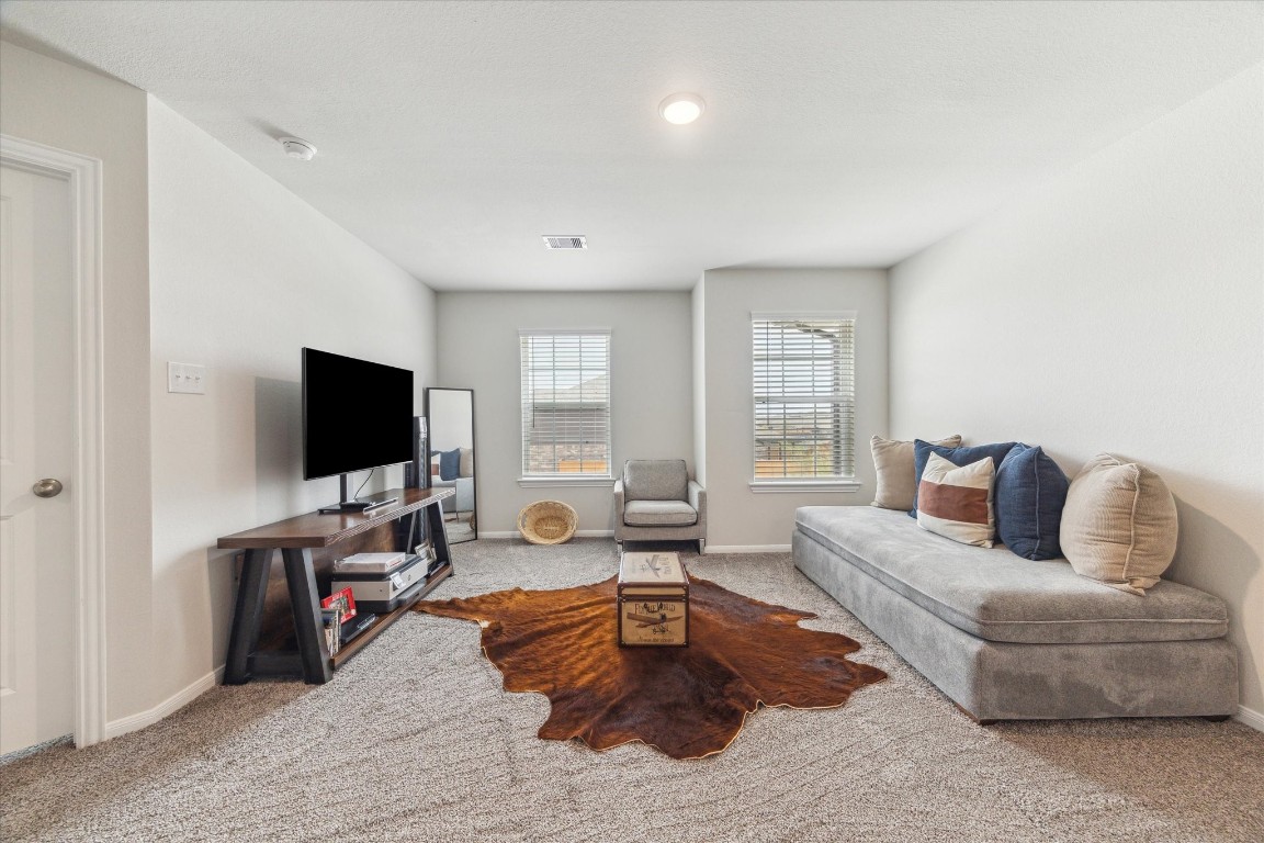 1523 Alpine Drive Rosharon, TX 77583 - Photo 18 of 25 a living room with furniture and a flat screen tv