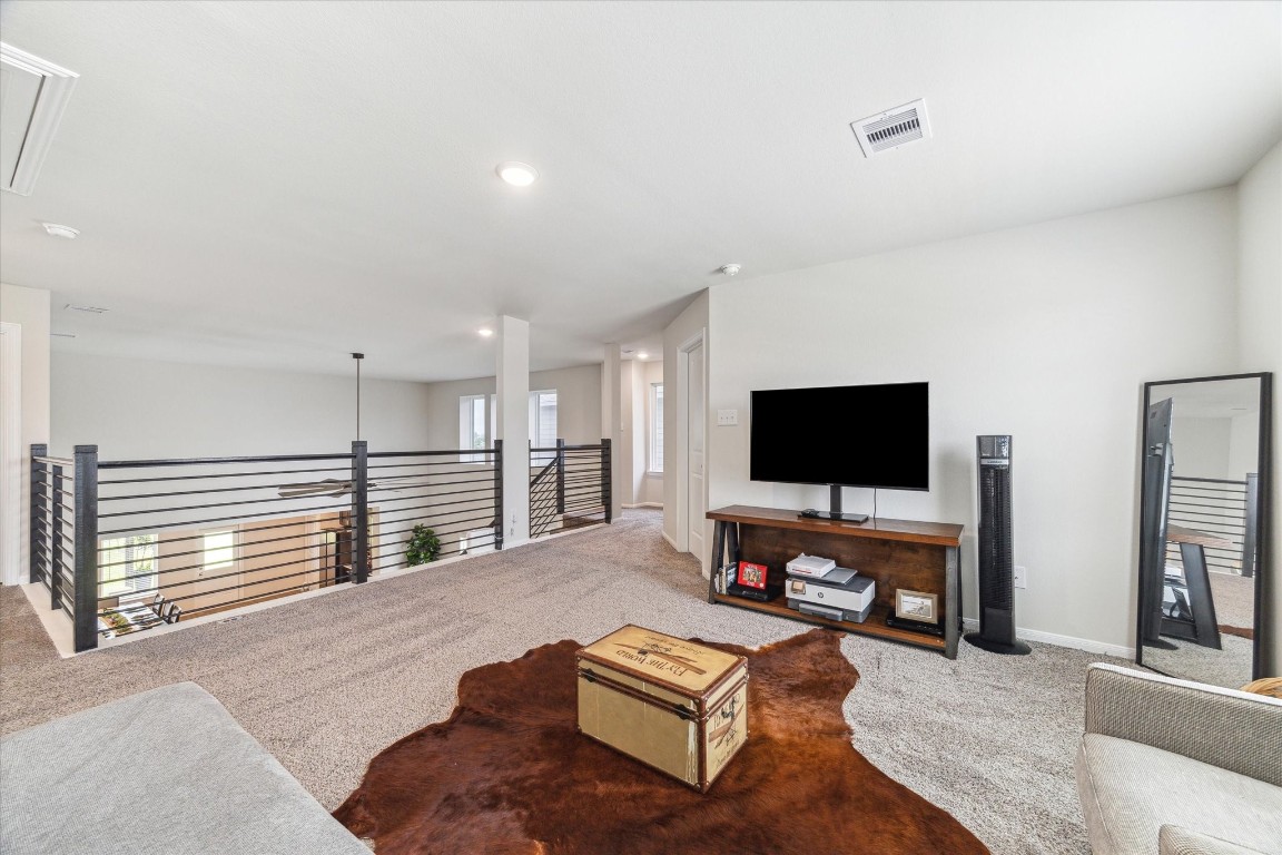 1523 Alpine Drive Rosharon, TX 77583 - Photo 19 of 25 a living room with furniture and a flat screen tv