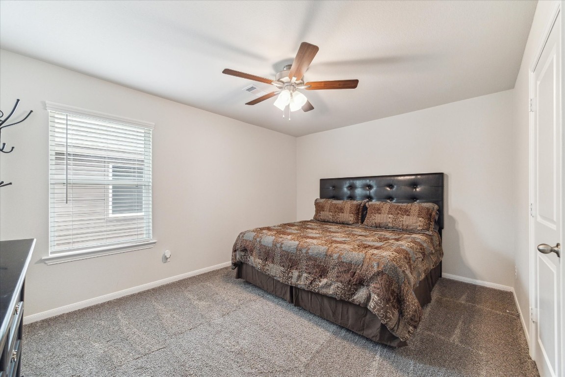 1523 Alpine Drive Rosharon, TX 77583 - Photo 20 of 25 a bedroom with a bed and window