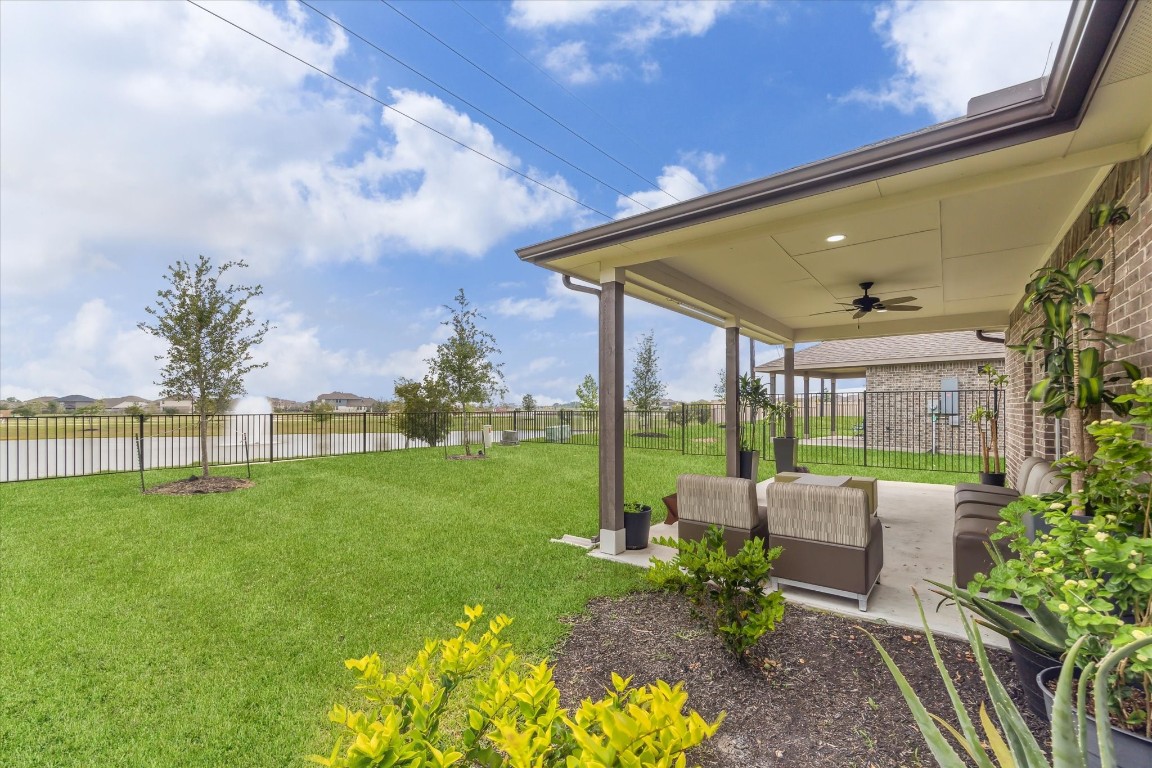 1523 Alpine Drive Rosharon, TX 77583 - Photo 23 of 25 a view of a patio with couches plants and large trees