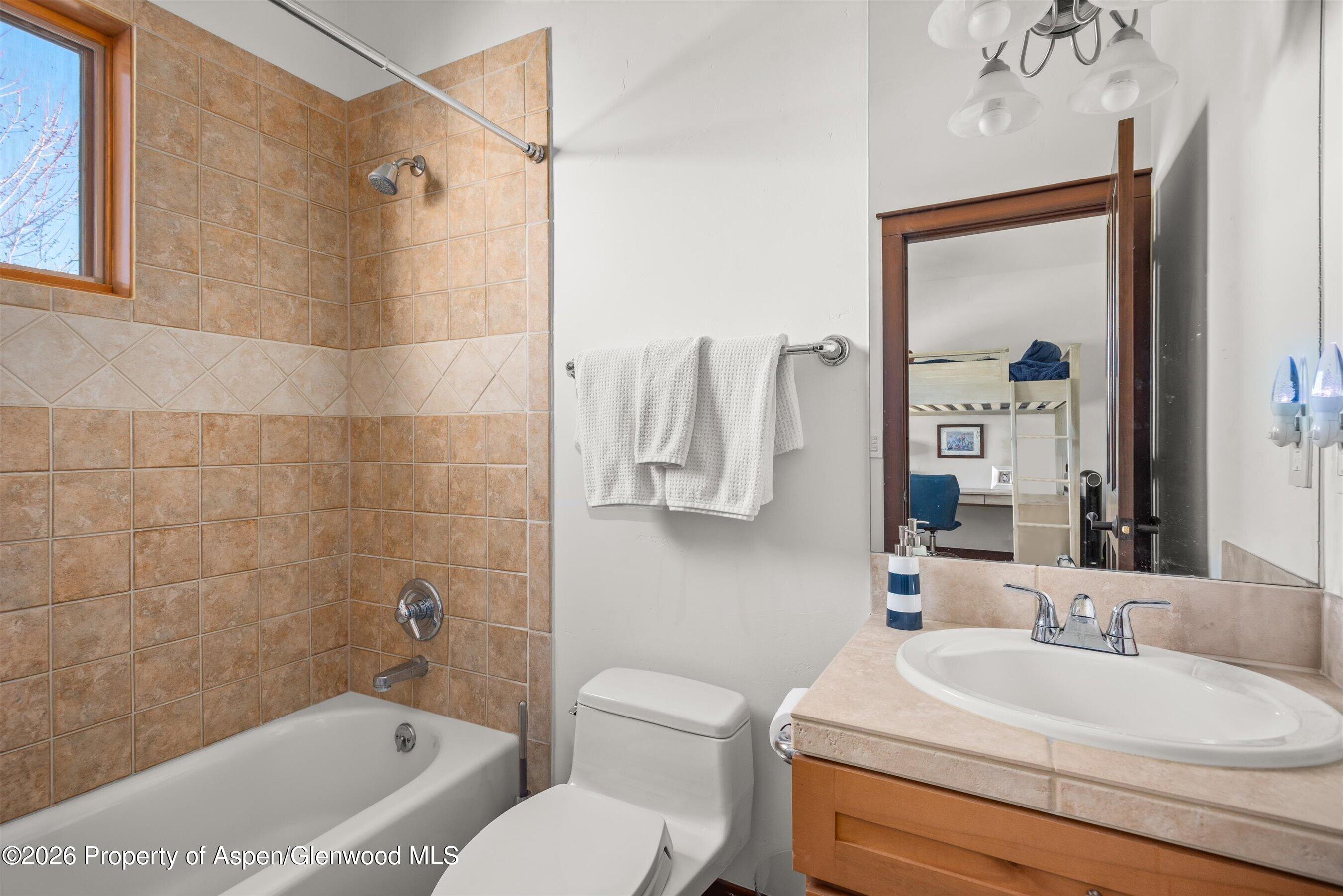 410 Meadow Court Basalt, CO 81621 - Photo 18 of 30 a bathroom with a sink and a mirror