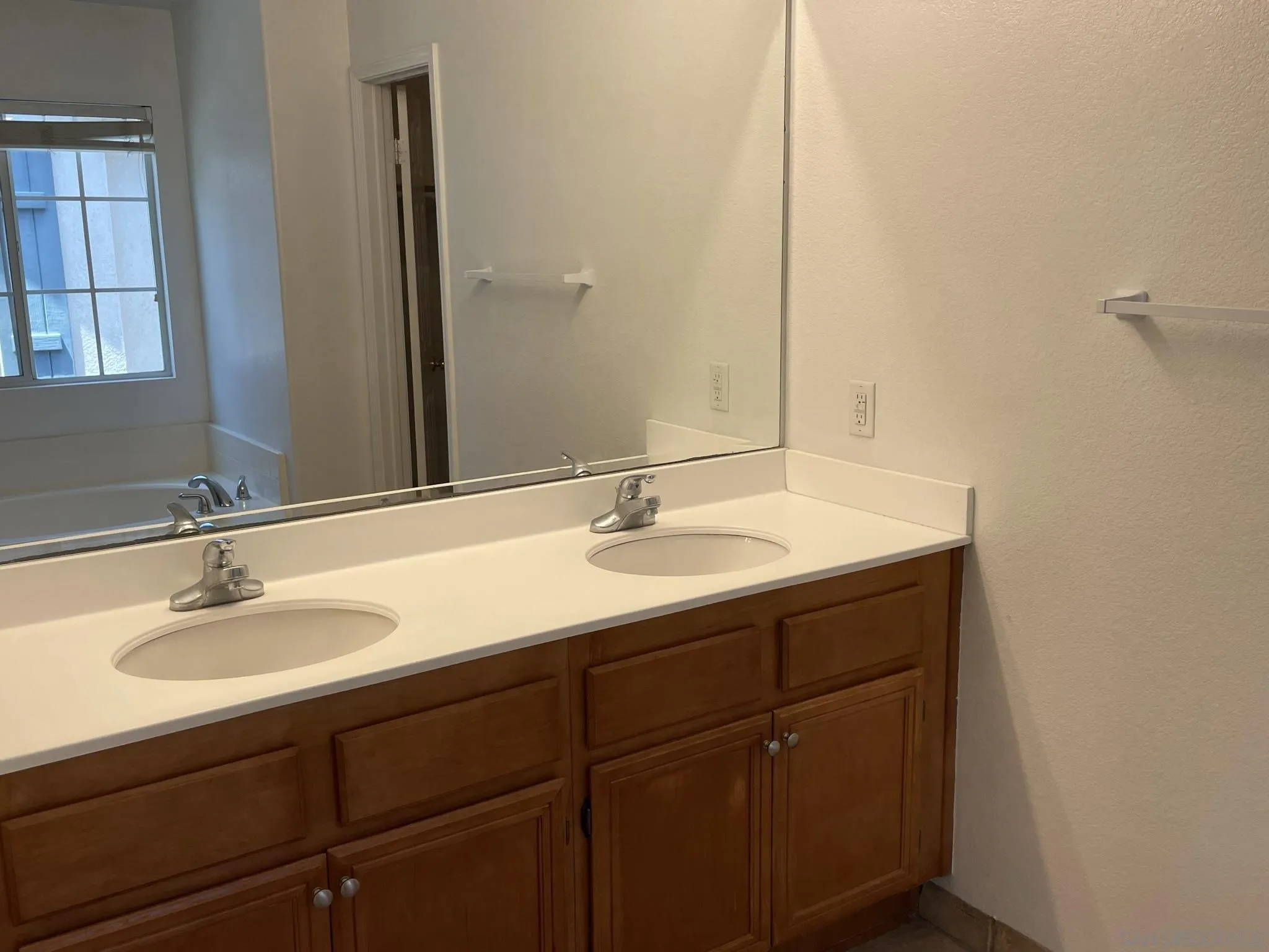 348 Monte Vista Way Oceanside, CA 92057 - Photo 12 of 20 a bathroom with a sink and a mirror