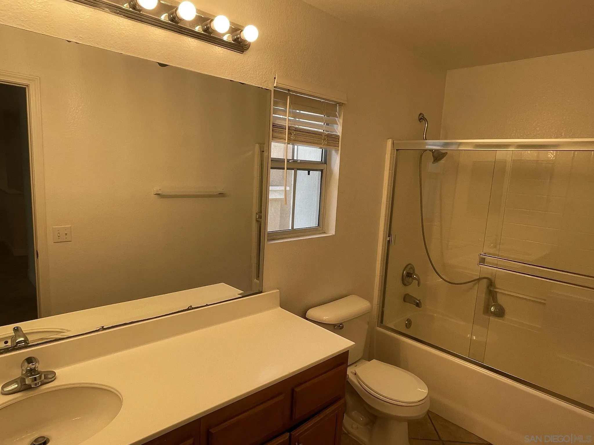 348 Monte Vista Way Oceanside, CA 92057 - Photo 14 of 20 a bathroom with a sink toilet and shower