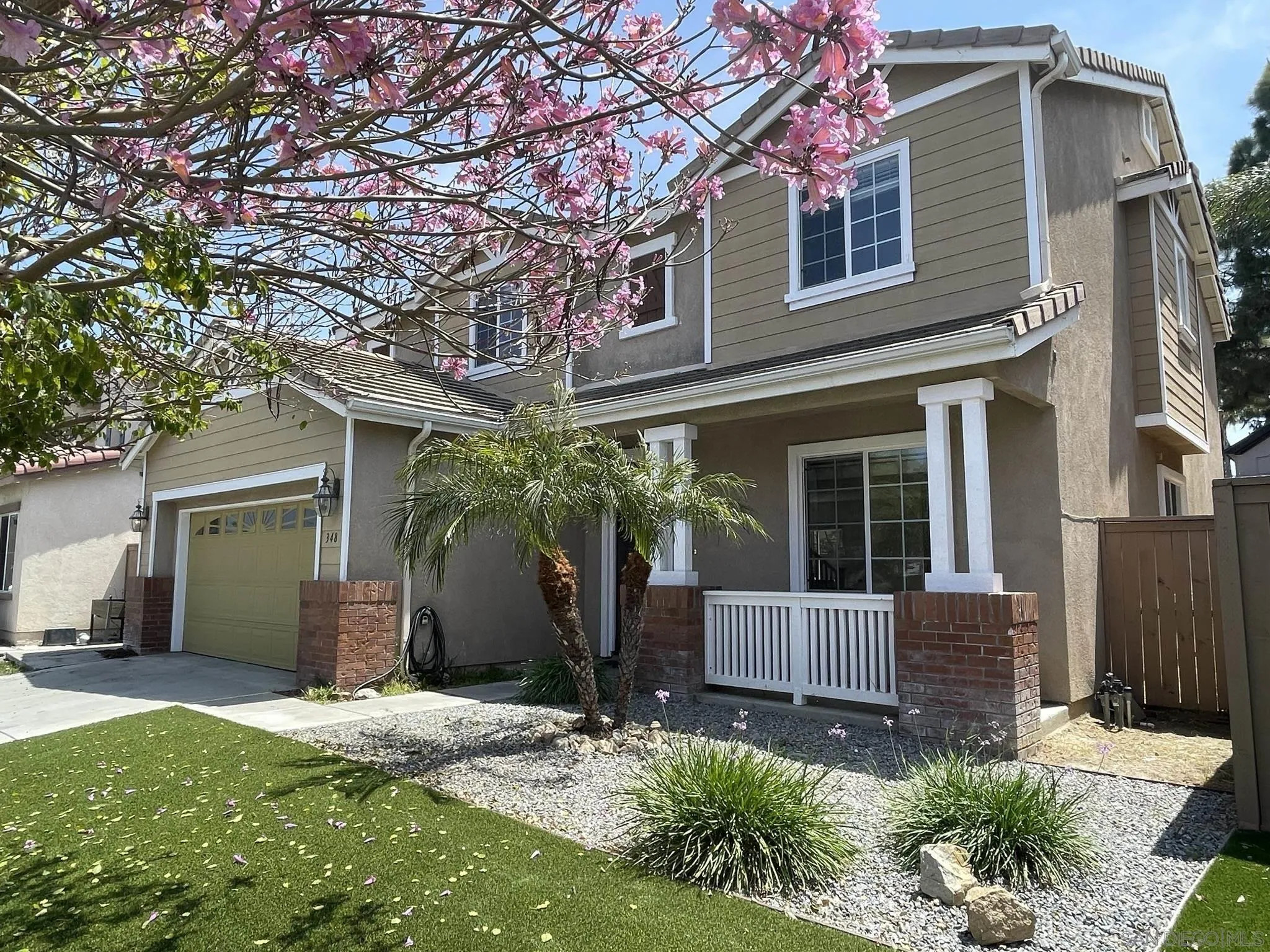 348 Monte Vista Way Oceanside, CA 92057 - Photo 2 of 20 a front view of a house with garden