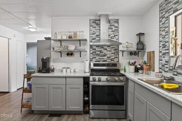 a kitchen with cabinets and window