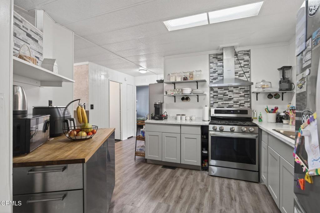 2408 Apple Lane, Unit 154 Oxnard, CA 93036 - Photo 16 of 46 a kitchen with stainless steel appliances granite countertop a stove and a sink