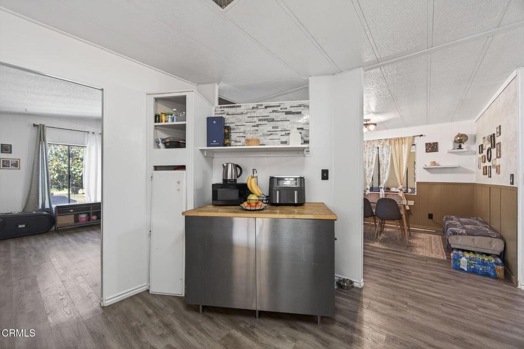 2408 Apple Lane, Unit 154 Oxnard, CA 93036 - Photo 17 of 46 a living room with furniture and a flat screen tv