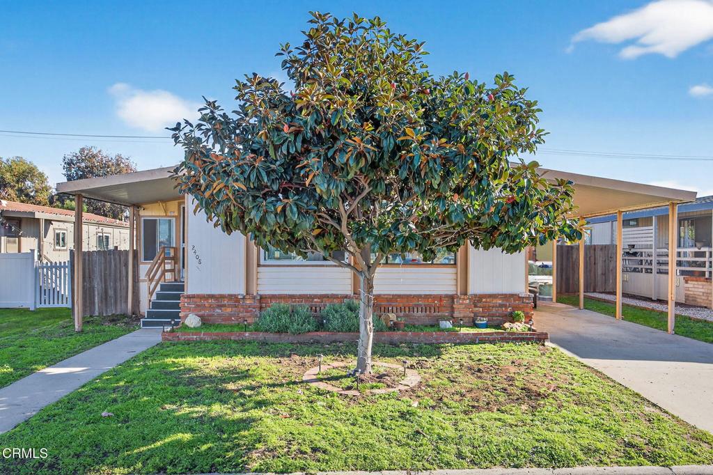 2408 Apple Lane, Unit 154 Oxnard, CA 93036 - Photo 2 of 46 a house with trees in front of it
