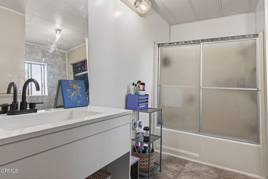 2408 Apple Lane, Unit 154 Oxnard, CA 93036 - Photo 23 of 46 a bathroom with a sink and a shower