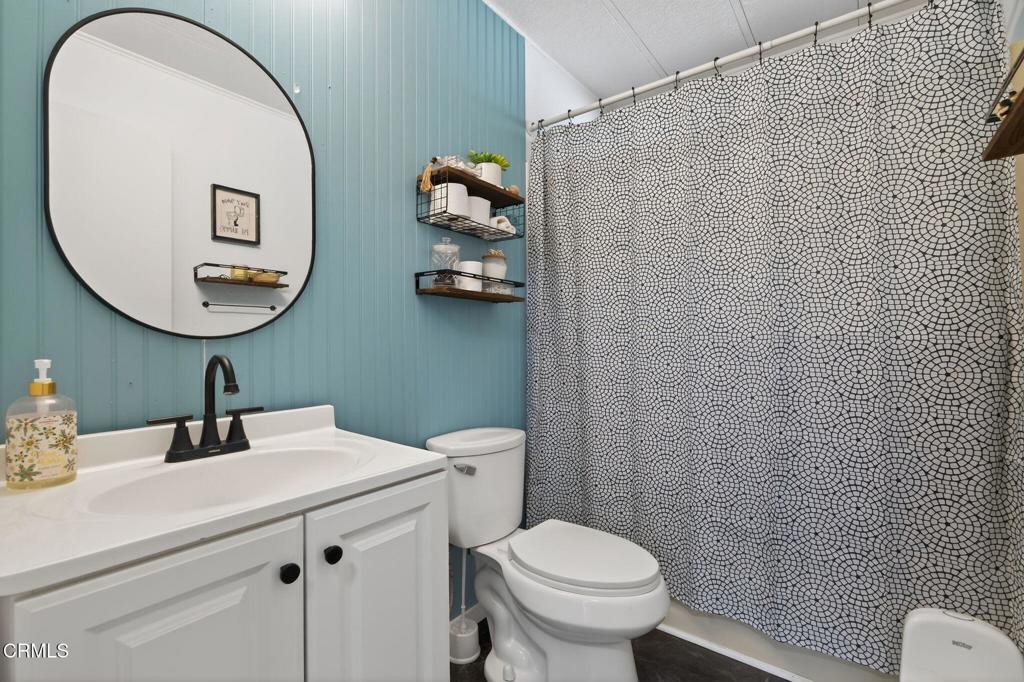 2408 Apple Lane, Unit 154 Oxnard, CA 93036 - Photo 24 of 46 a bathroom with a toilet sink and mirror