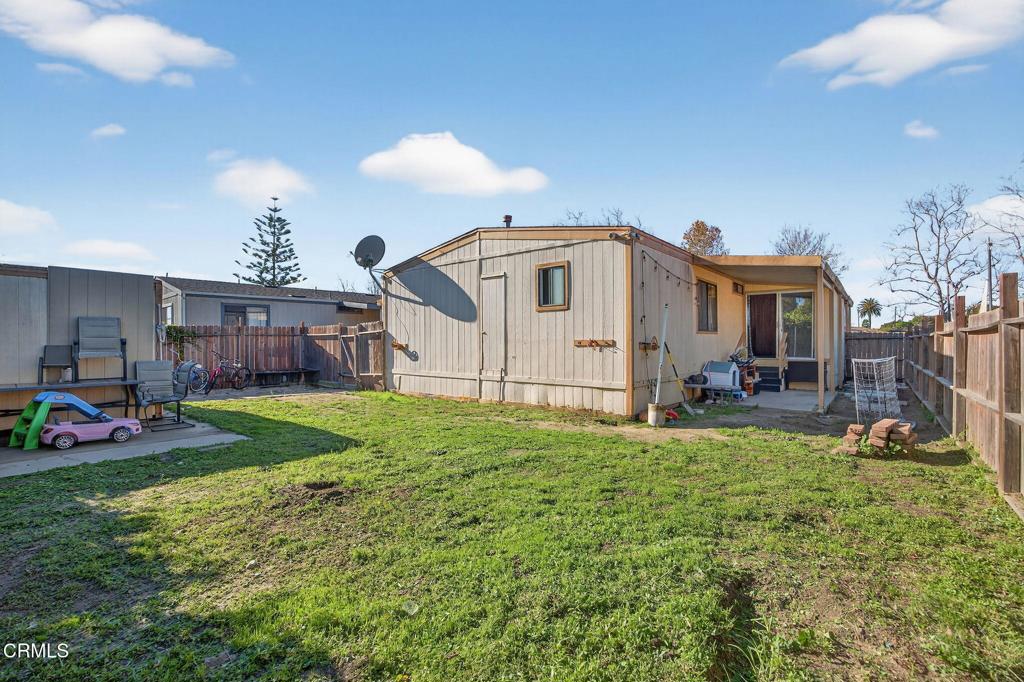2408 Apple Lane, Unit 154 Oxnard, CA 93036 - Photo 35 of 46 a front view of a house with a yard