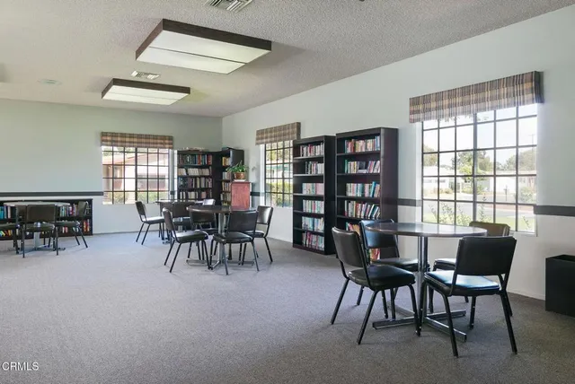 a view of a a dining room with furniture window and outside view