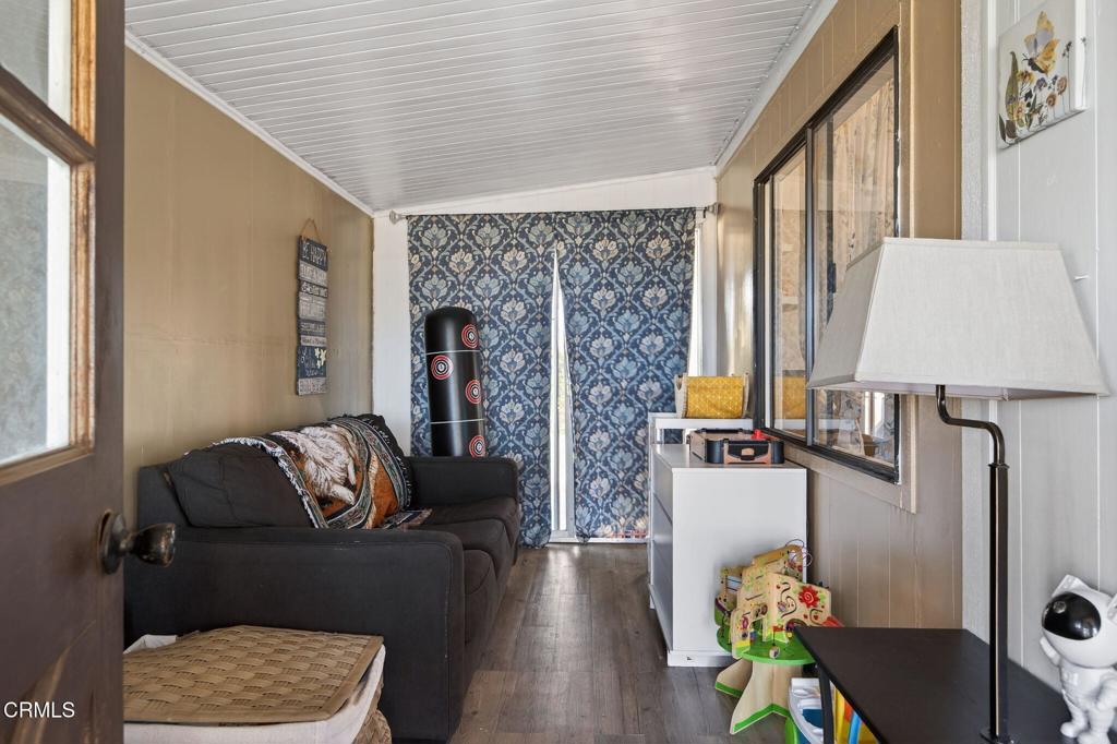 2408 Apple Lane, Unit 154 Oxnard, CA 93036 - Photo 4 of 46 a living room with furniture and wooden floor