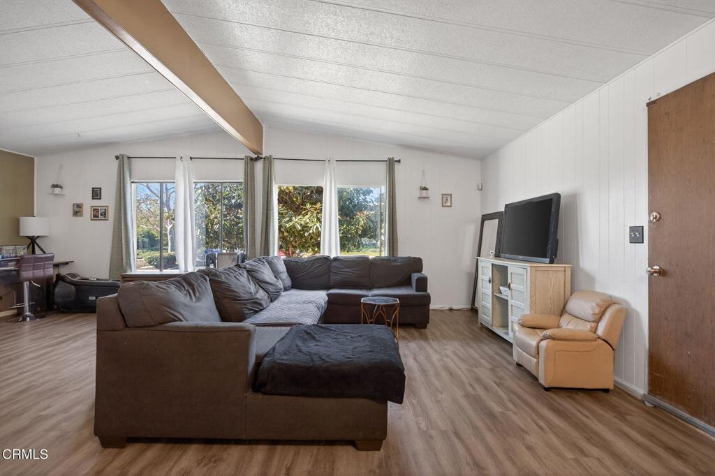 2408 Apple Lane, Unit 154 Oxnard, CA 93036 - Photo 7 of 46 a living room with furniture and a flat screen tv