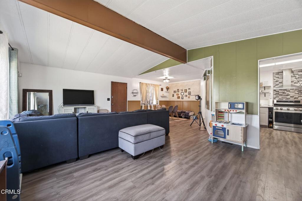 2408 Apple Lane, Unit 154 Oxnard, CA 93036 - Photo 10 of 46 a living room with furniture and a flat screen tv