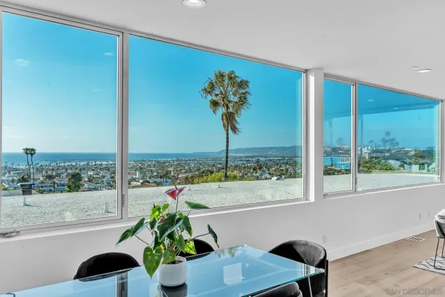 a vase of flowers sitting next to a window