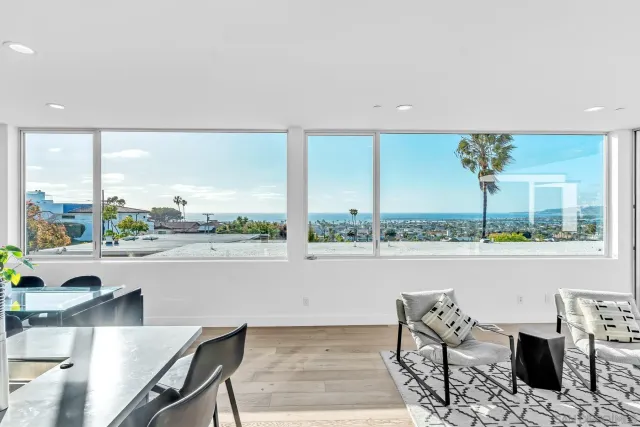 a view of a workspace with a table and chair