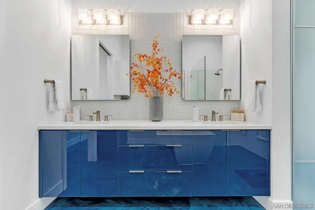 a bathroom with a tub sink and mirror